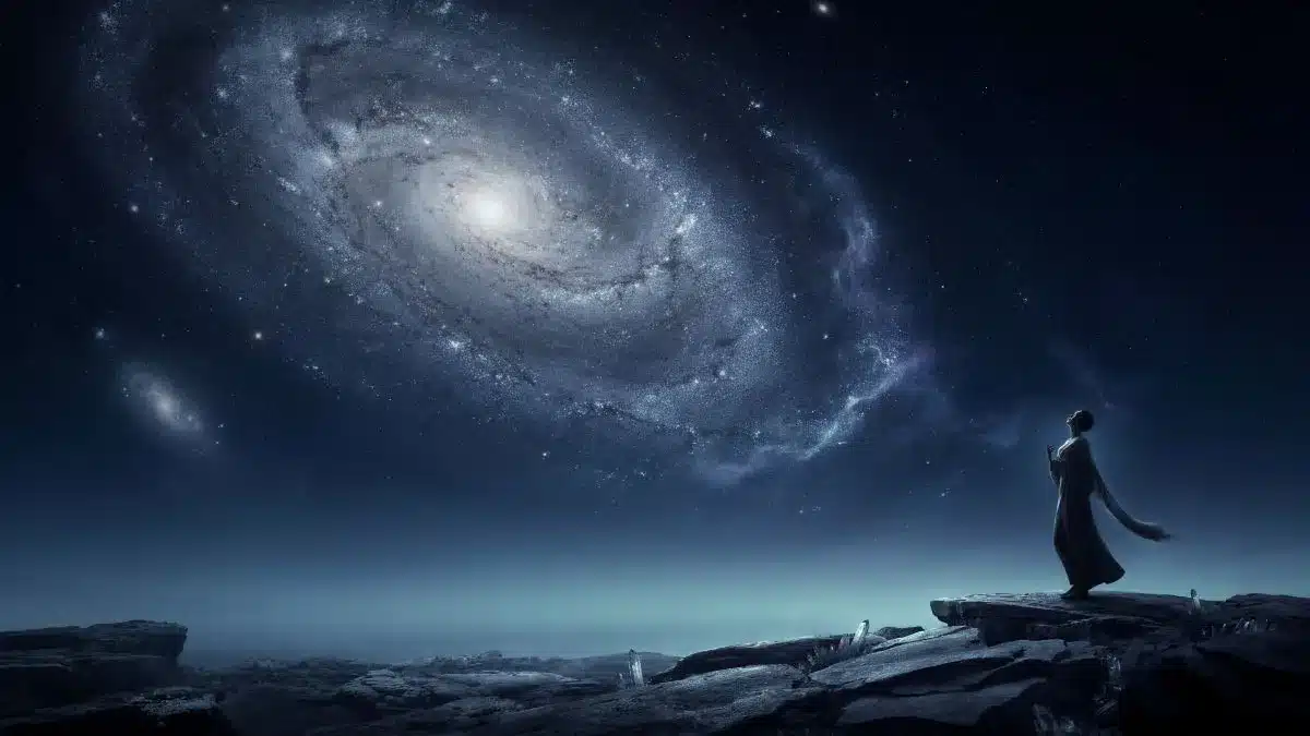 Andromedan Starseed and Cosmic Exploration Cosmic figure gazing towards a luminous galaxy, symbolising Andromedan starseed spirituality.