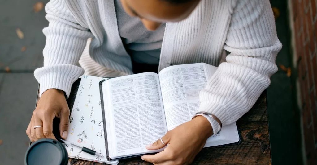 Person in quiet time reading Scripture, nurturing daily spiritual life Christian practice.